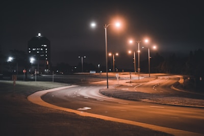 Evening view of a newly paved road with streetlights glowing softly in Akur Takur Para.