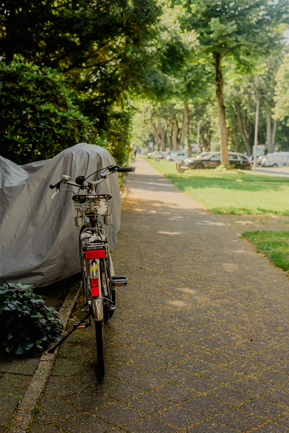 a bicycle parked on a sidewalk