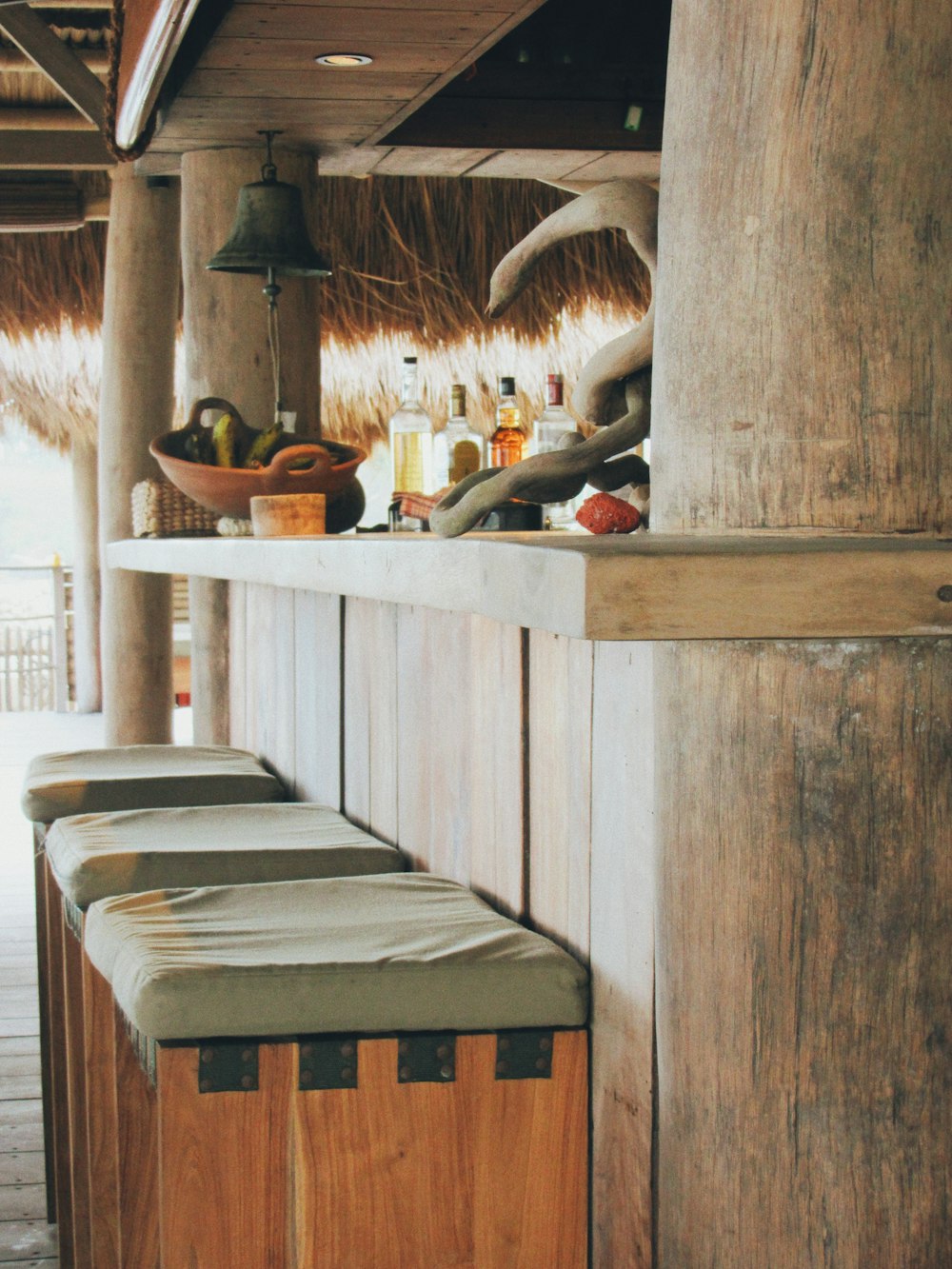 a kitchen with a shelf and a table with a basket and a basket