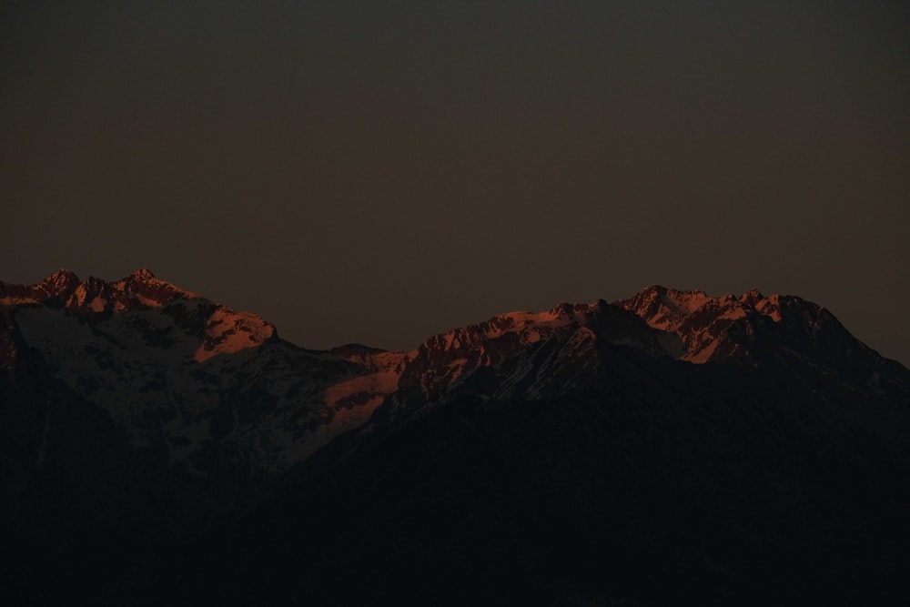 a mountain with a dark sky