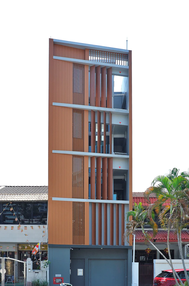 a tall building with a small balcony
