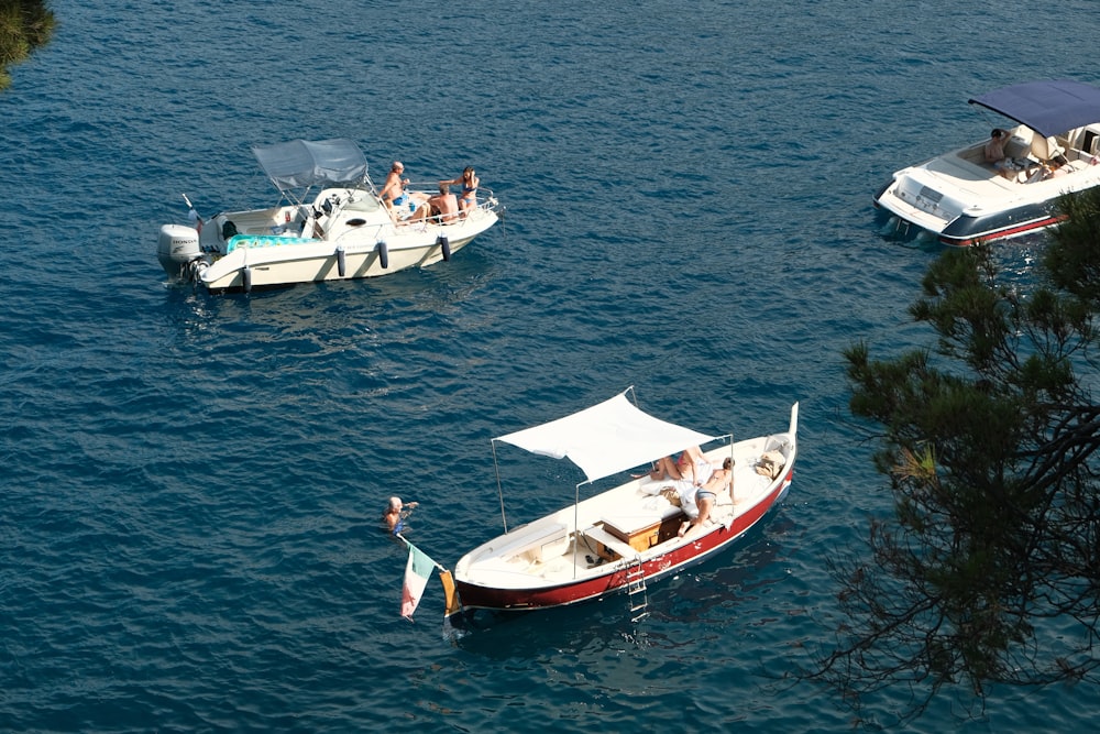 a group of boats are floating on the water