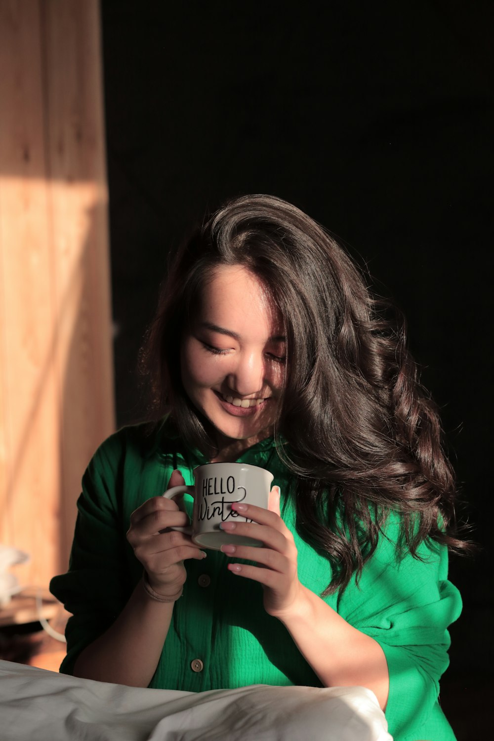 a woman holding a coffee cup