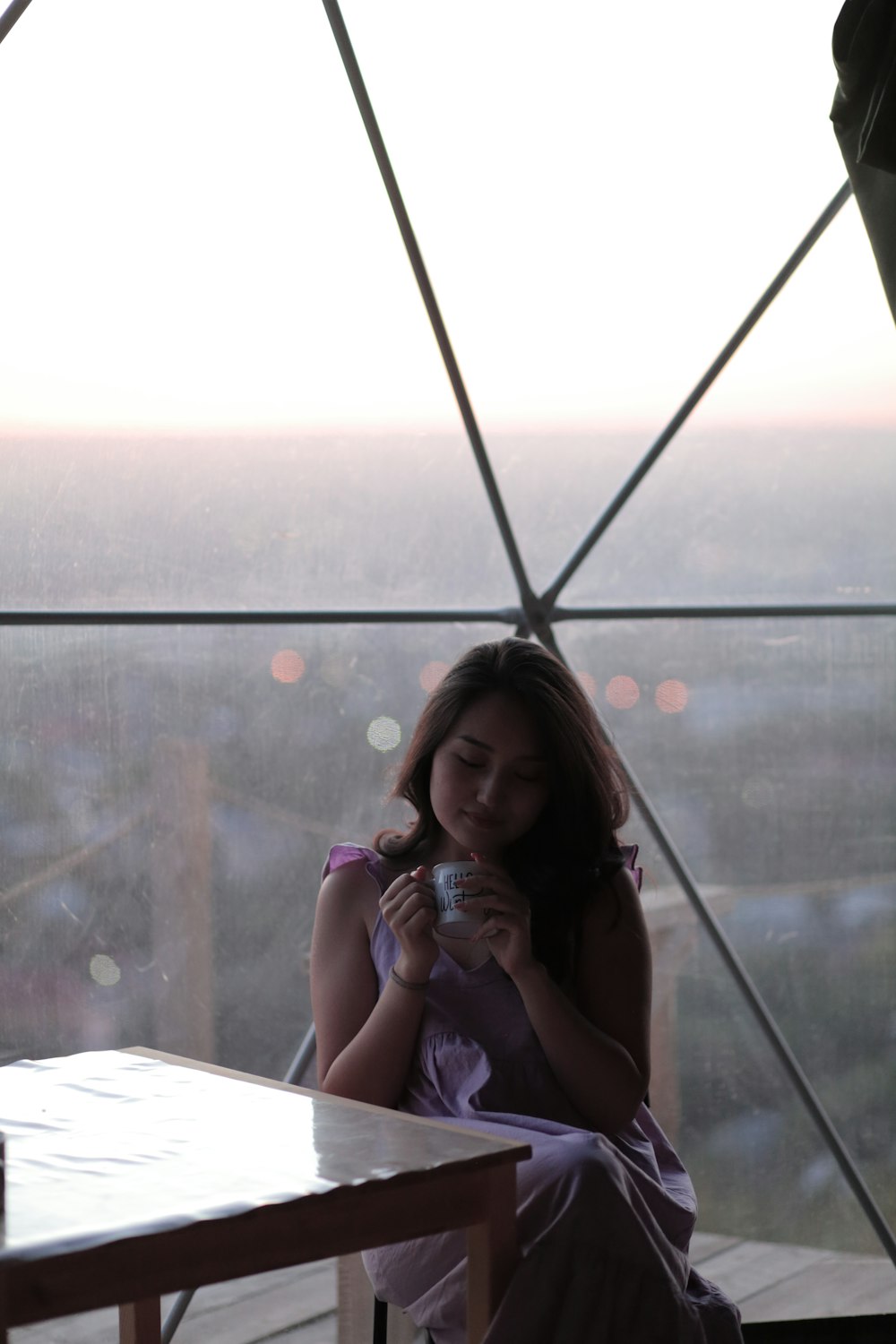 a woman sitting at a table