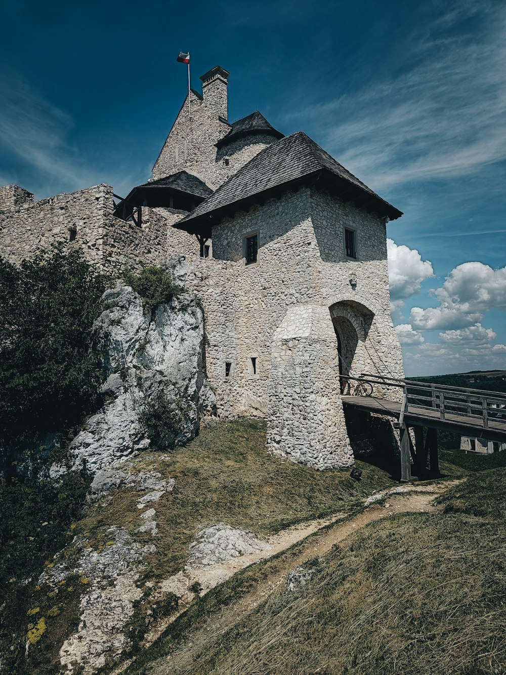 a stone castle on a cliff