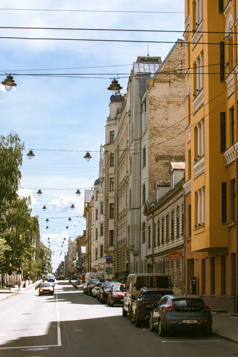 a street with cars and buildings on either side of it