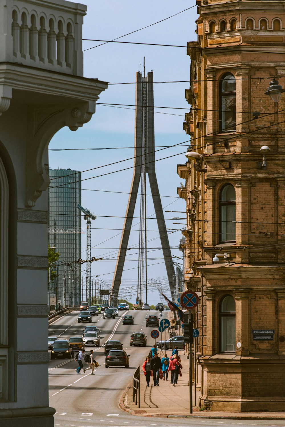 a city street with cars and people