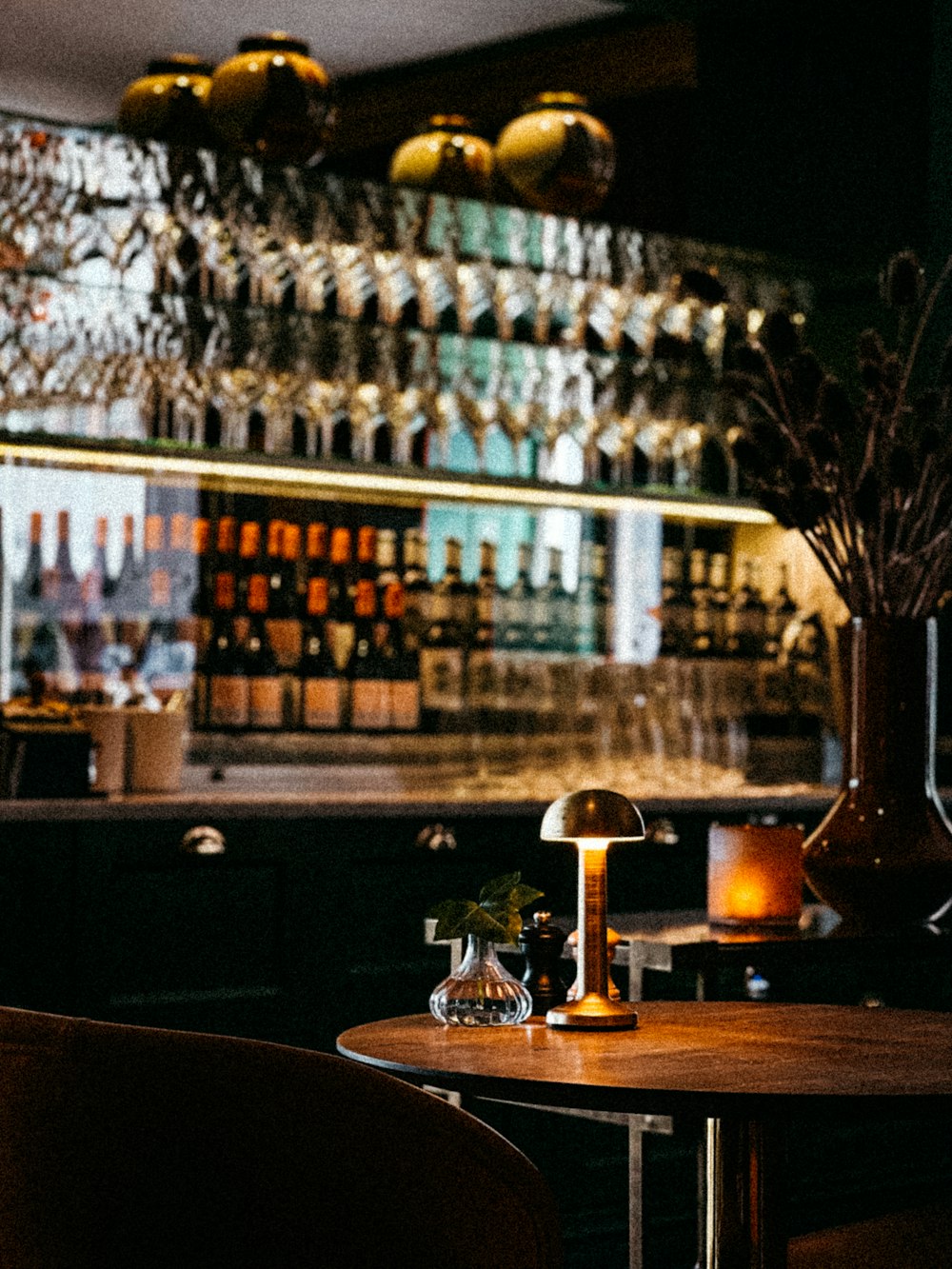 a bar with many bottles of alcohol