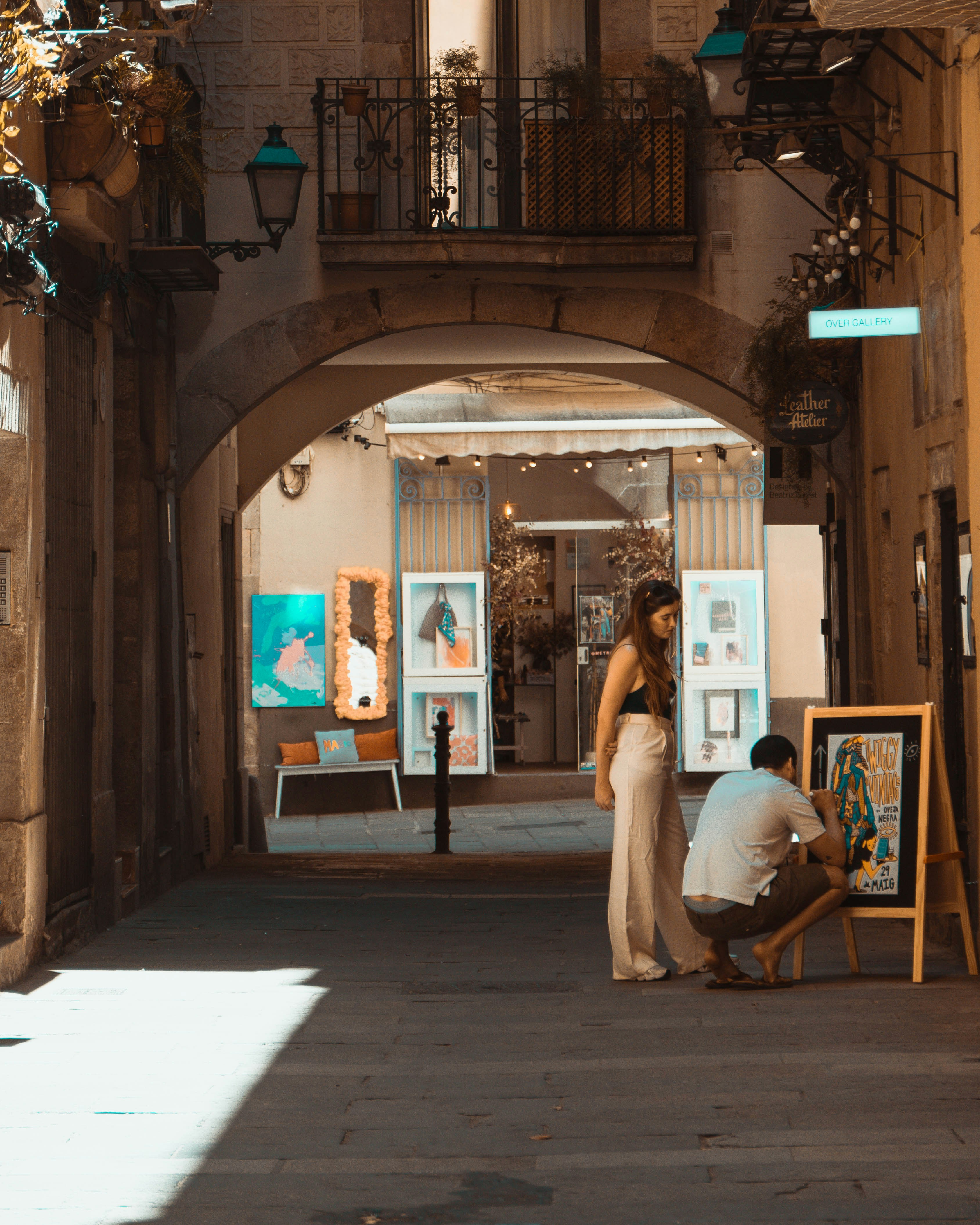 A person standing in front of a storefront photo – Free Barcelona Image ...