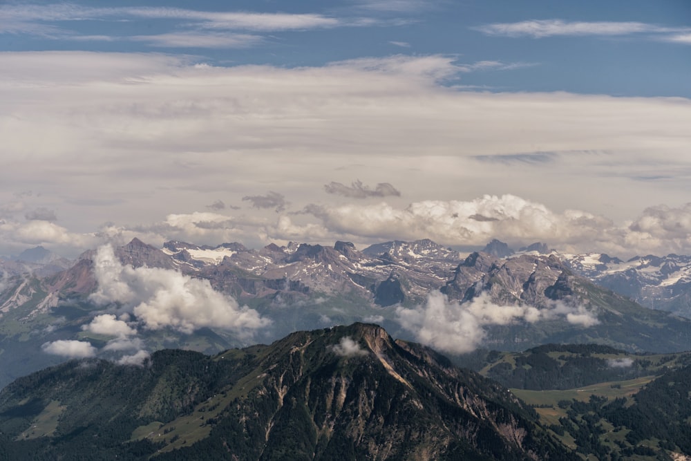 a mountain range with clouds