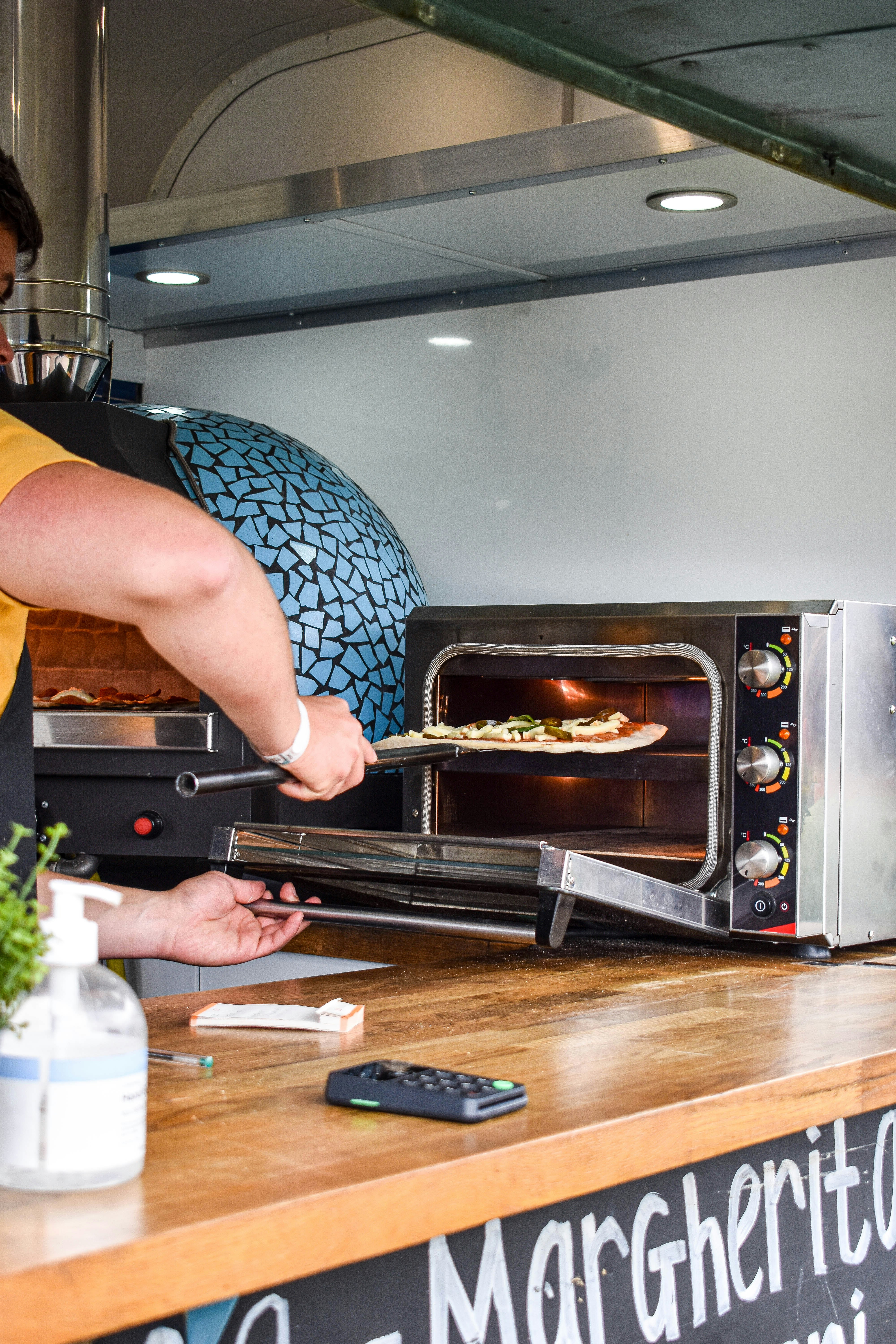 a woman cooking food in an oven
