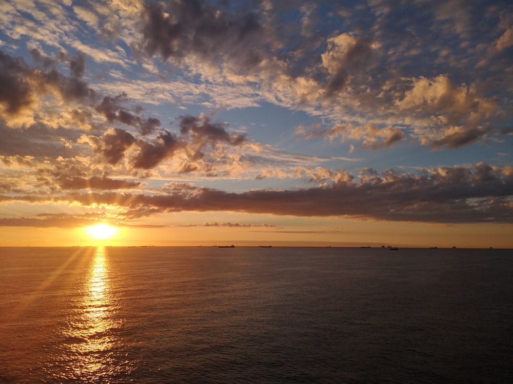 a sunset over a body of water