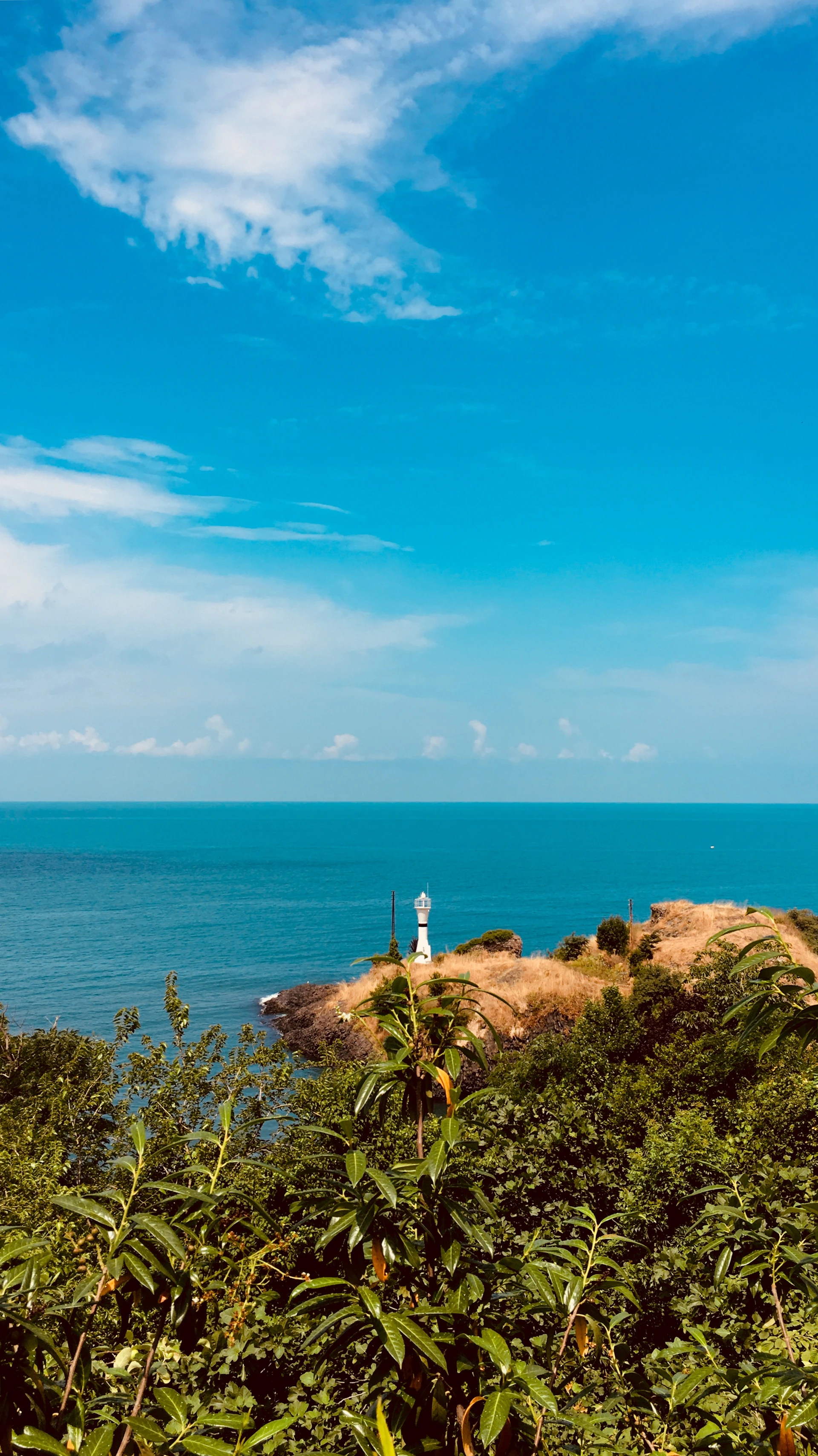 a lighthouse on a rocky island