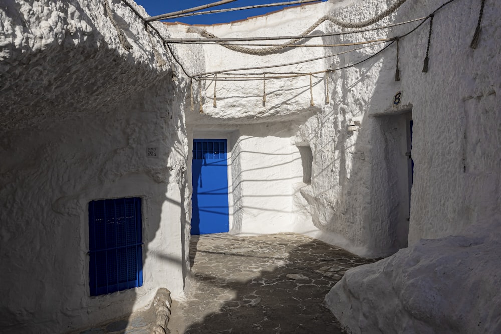 a narrow alley between two stone buildings