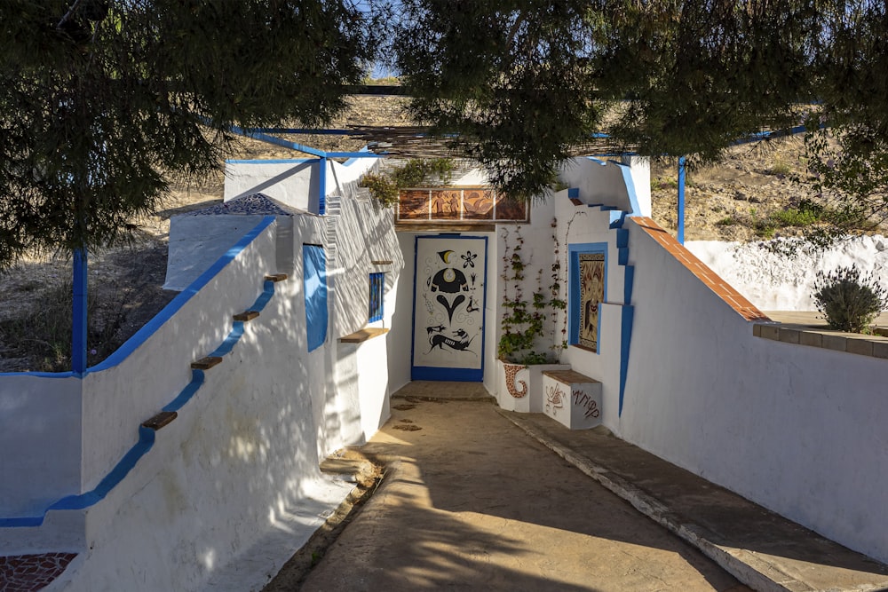 a white building with blue doors