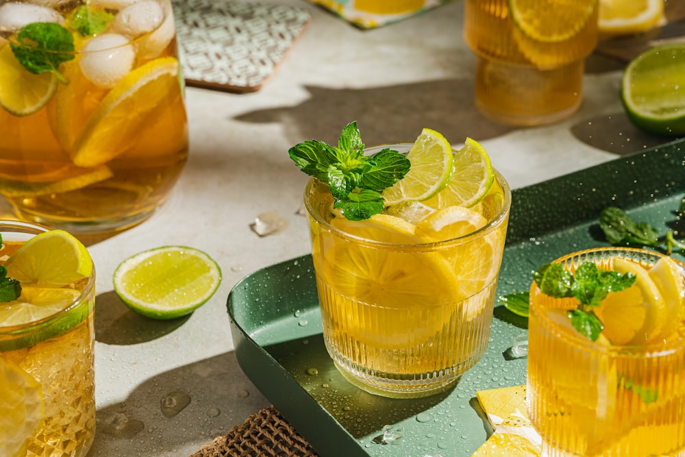 a group of glasses with liquid in them