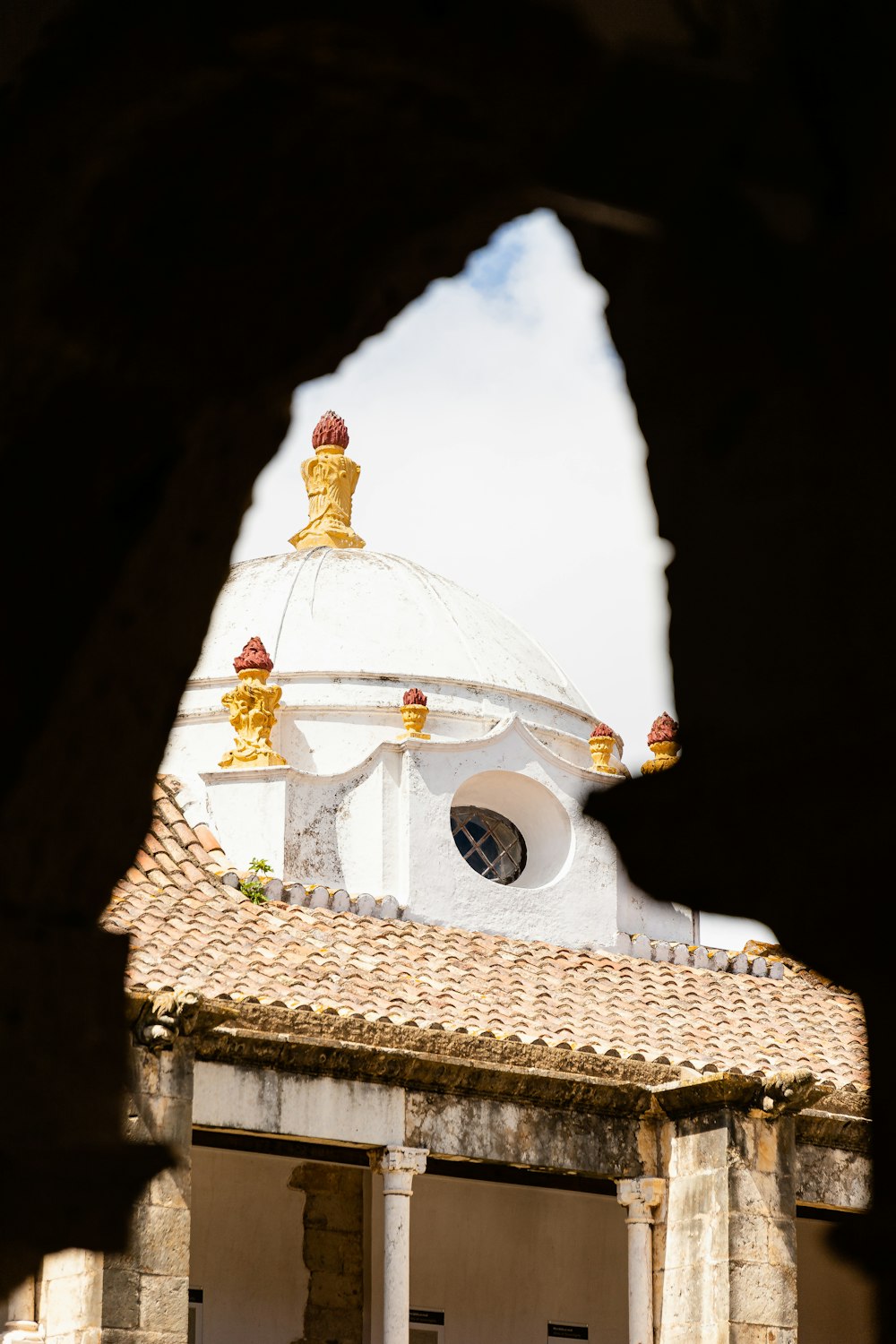 a building with a statue on top