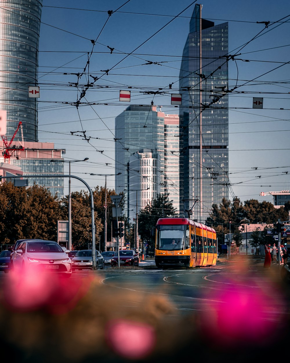 a city street with a bus and cars