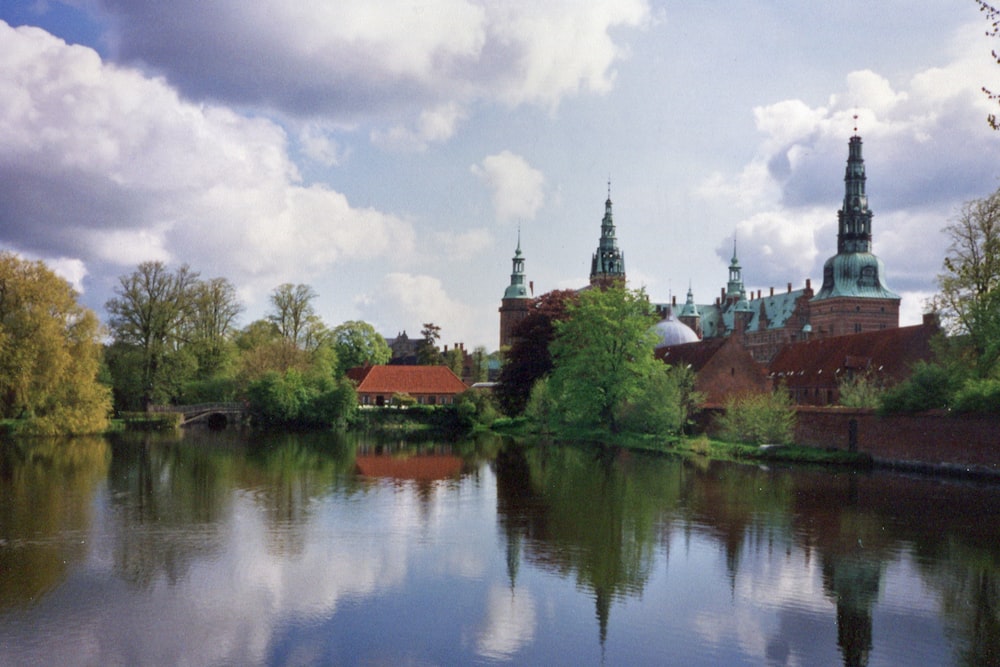 a body of water with a building in the background