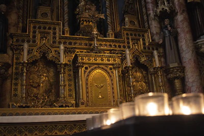 A mystical altar adorned with deep purple candles, gold accents, and ritual tools glowing softly in candlelight.