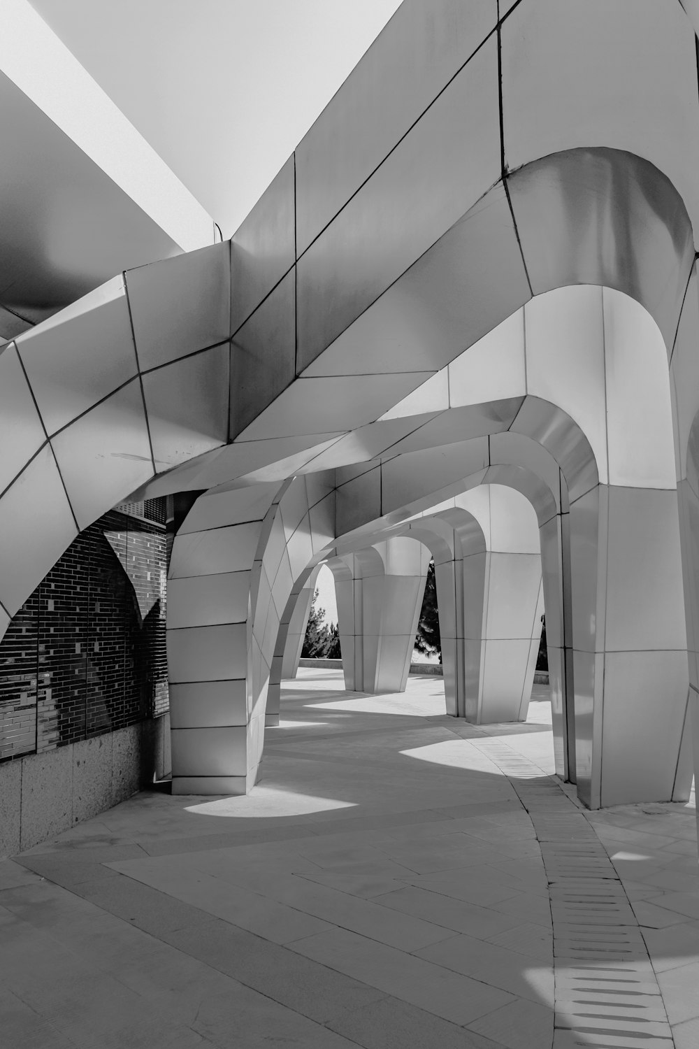 a walkway with white walls