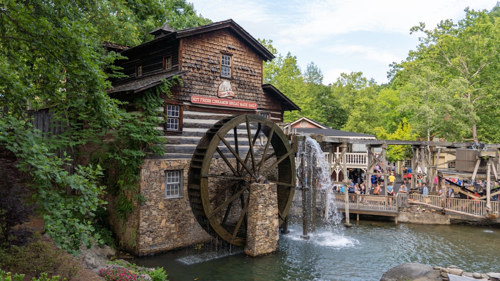 a water wheel next to a building