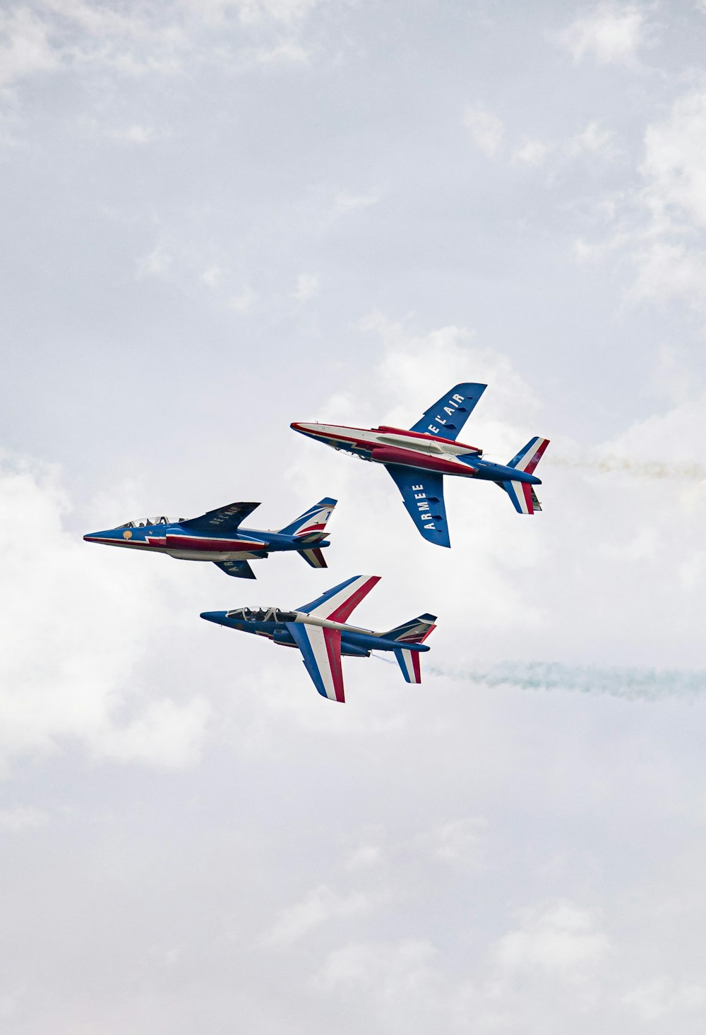 a group of jets fly through the air