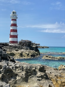 a lighthouse on a rocky island