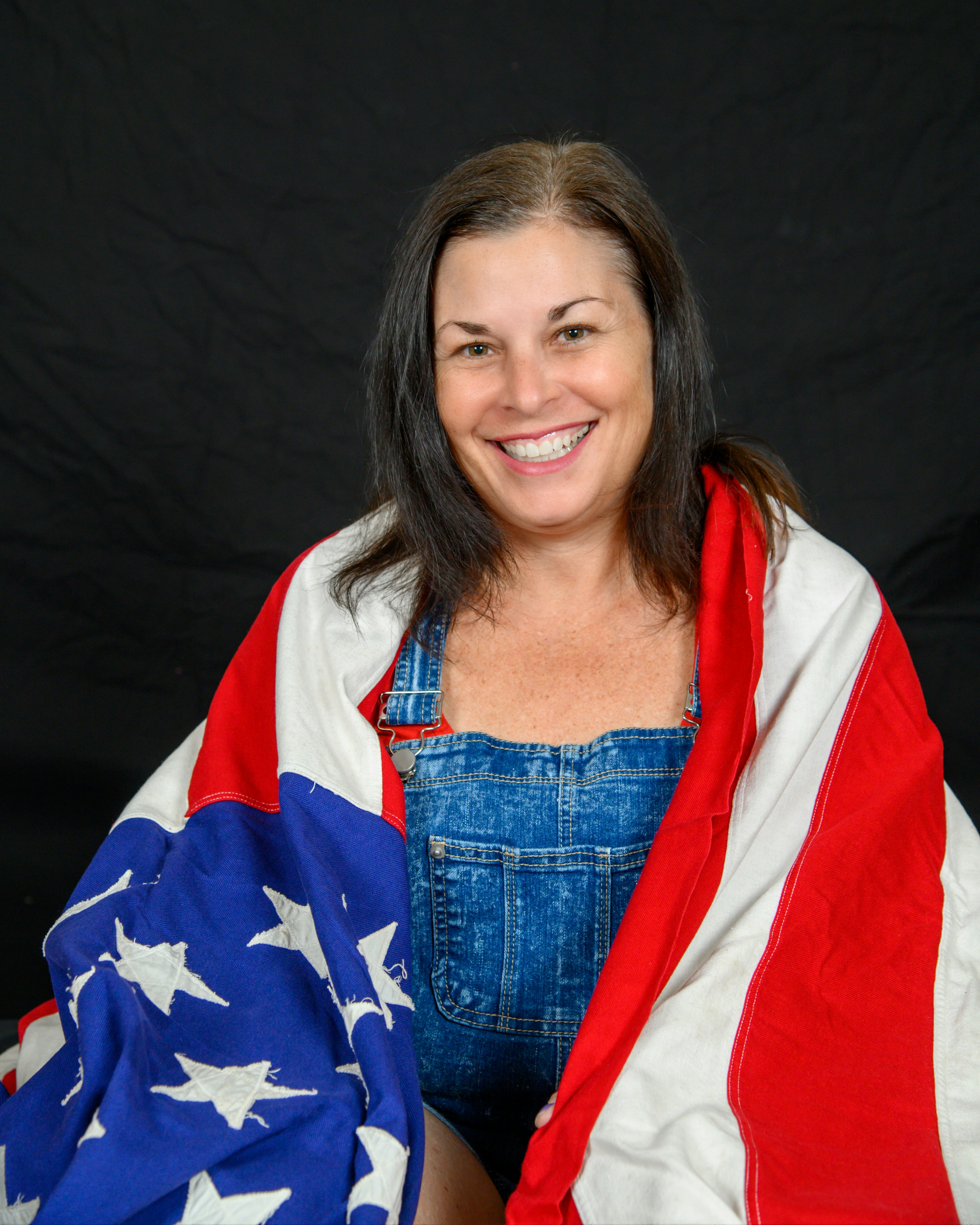 a person smiling with a flag
