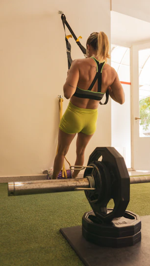 a woman wearing a garment and holding a gun
