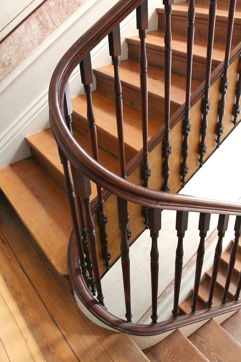 a wooden staircase with railings