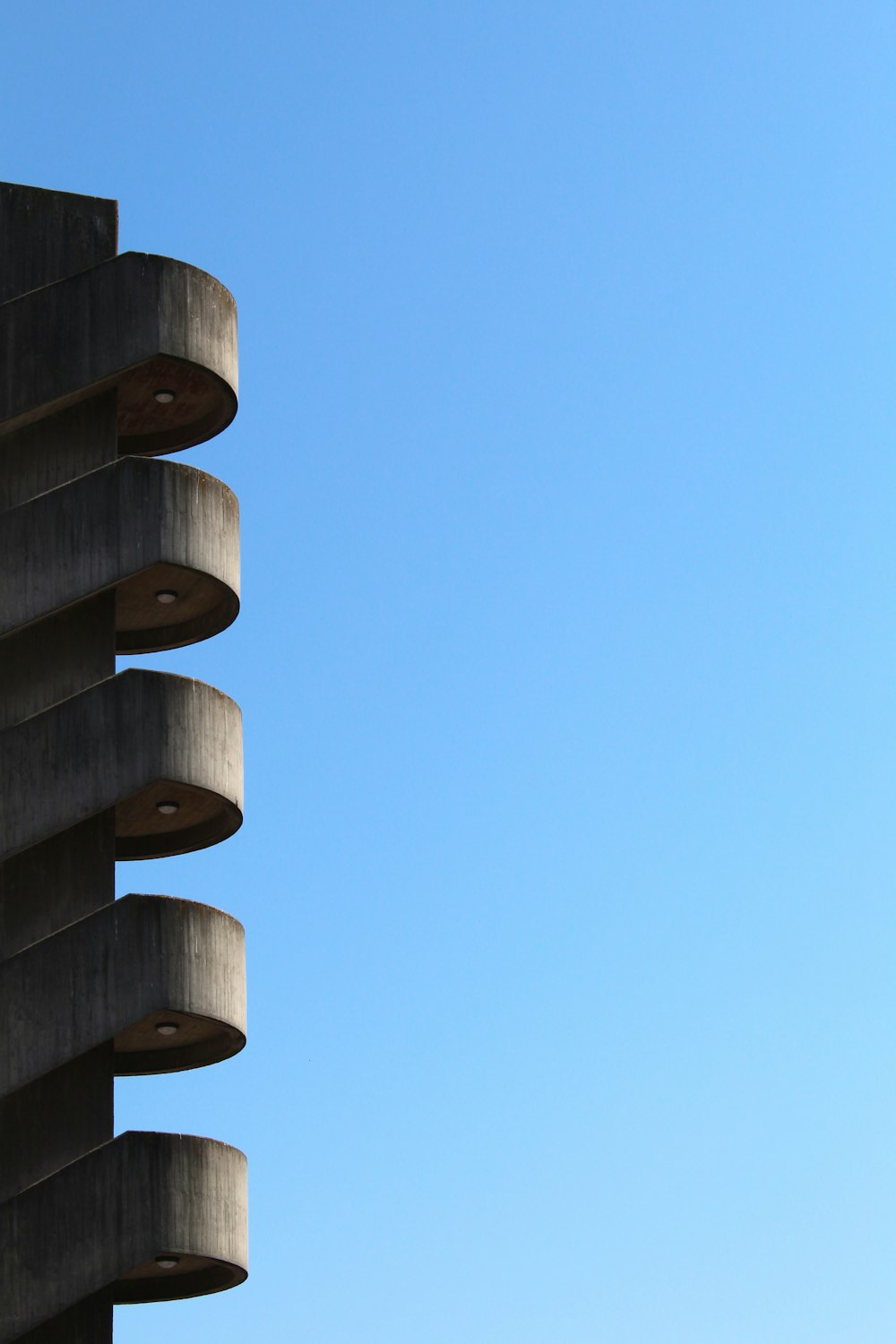 a tall building with a blue sky