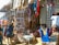 A vibrant market scene showcasing colorful fabrics and handmade accessories from West Africa.