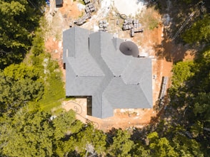a large stone building surrounded by trees