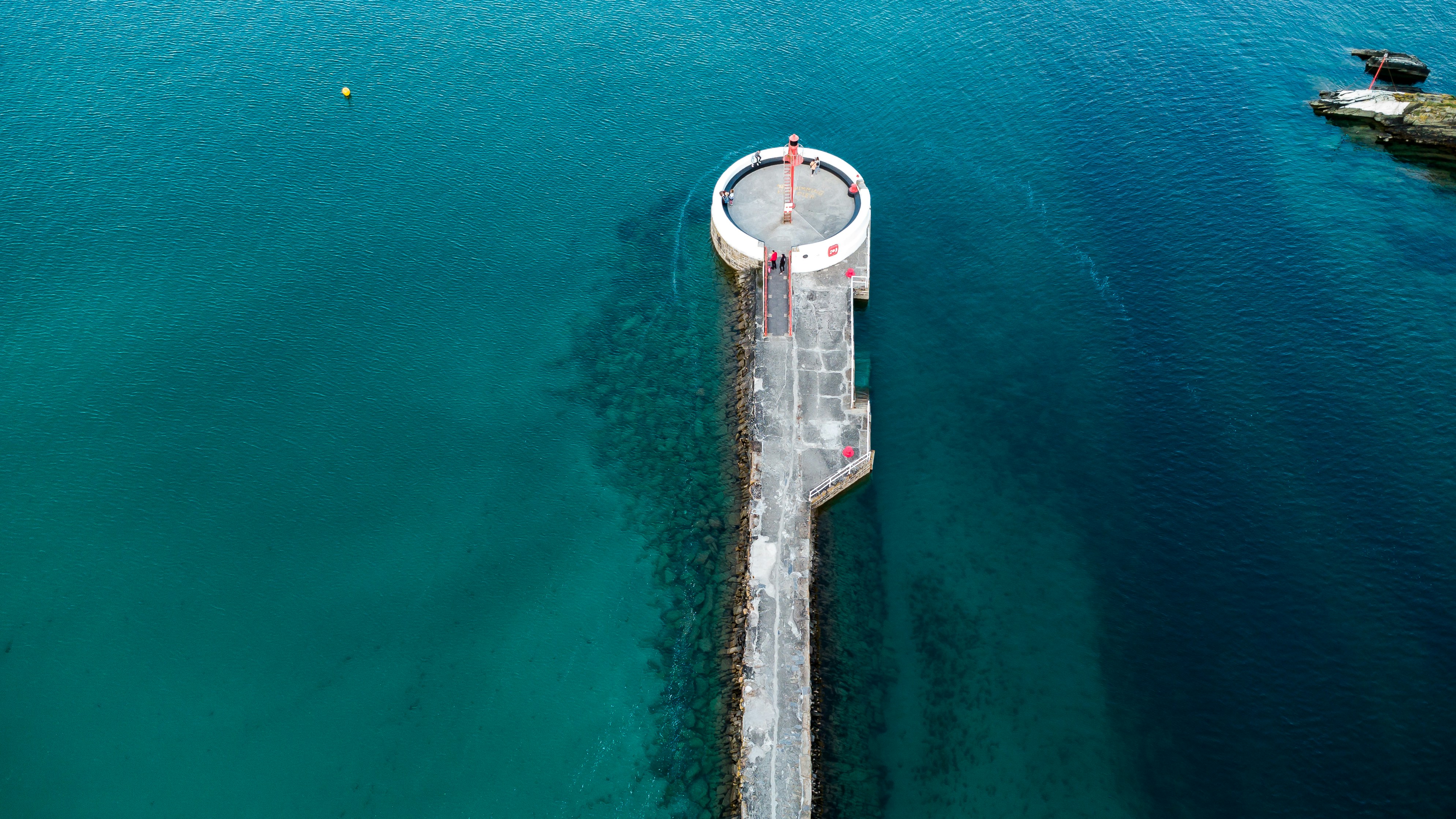 a large tower in the middle of a body of water