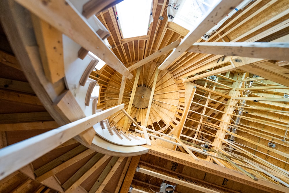 a wooden ceiling with a fan