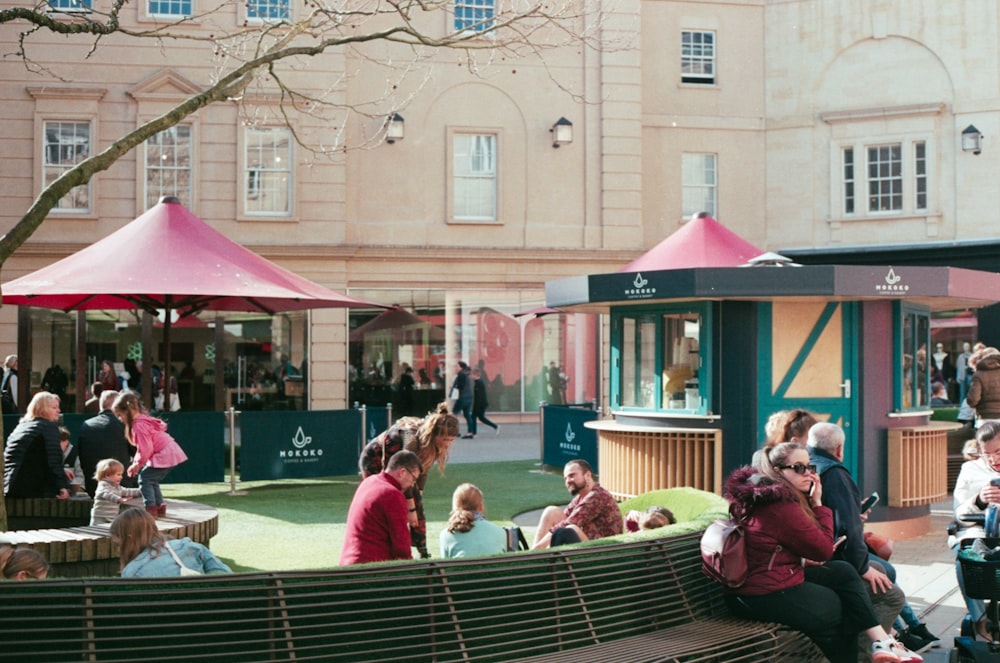 a group of people sitting outside