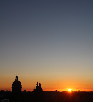 A breathtaking sunset shot over an urban skyline showcasing architectural details.