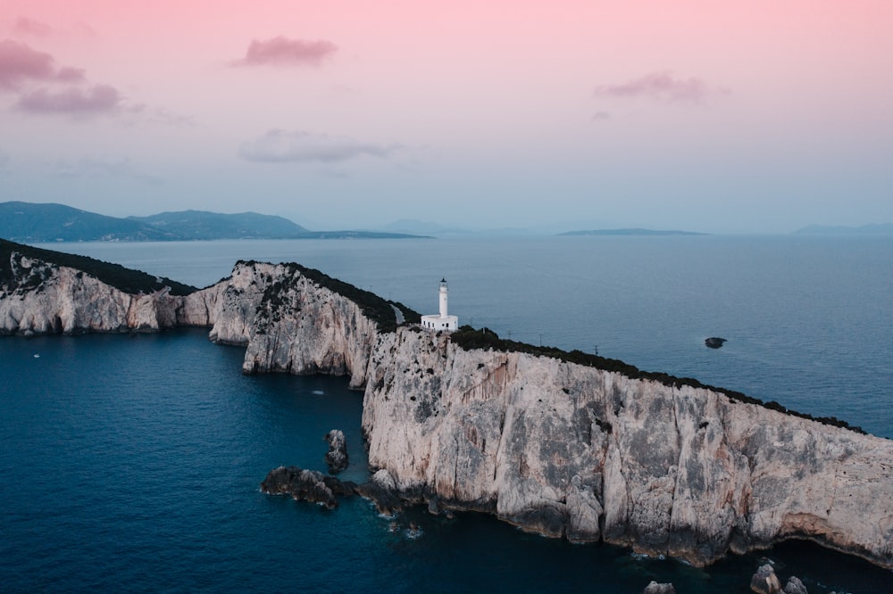 a lighthouse on a rocky cliff