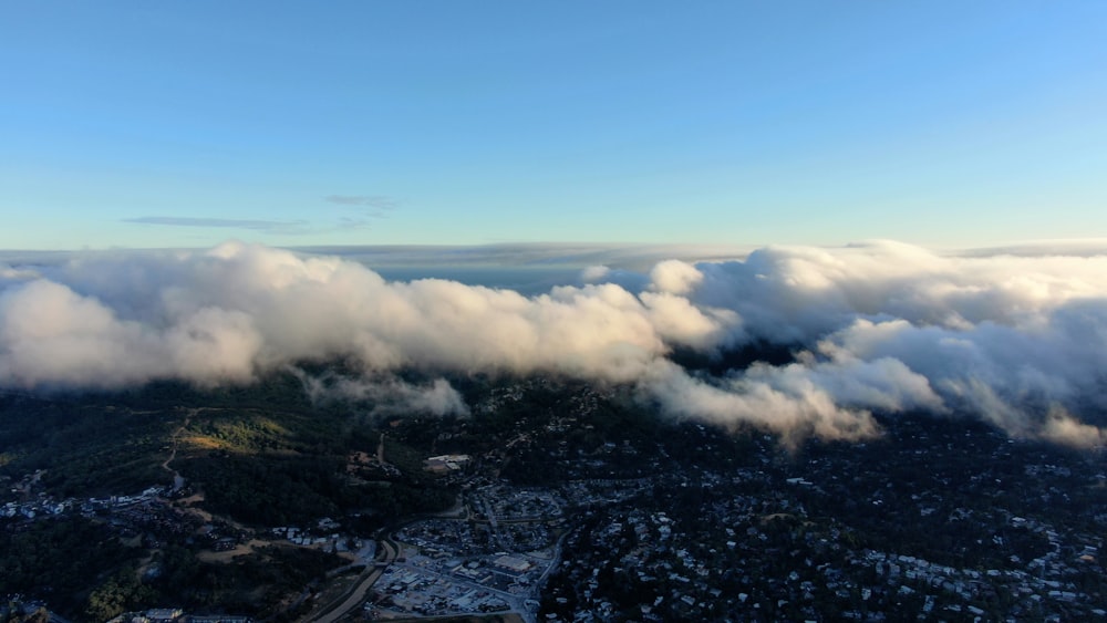 a view of a city and clouds from above
