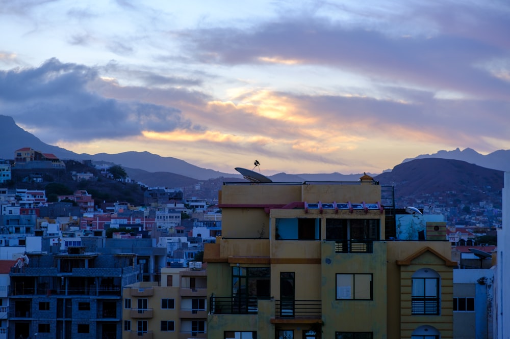 a city with mountains in the background