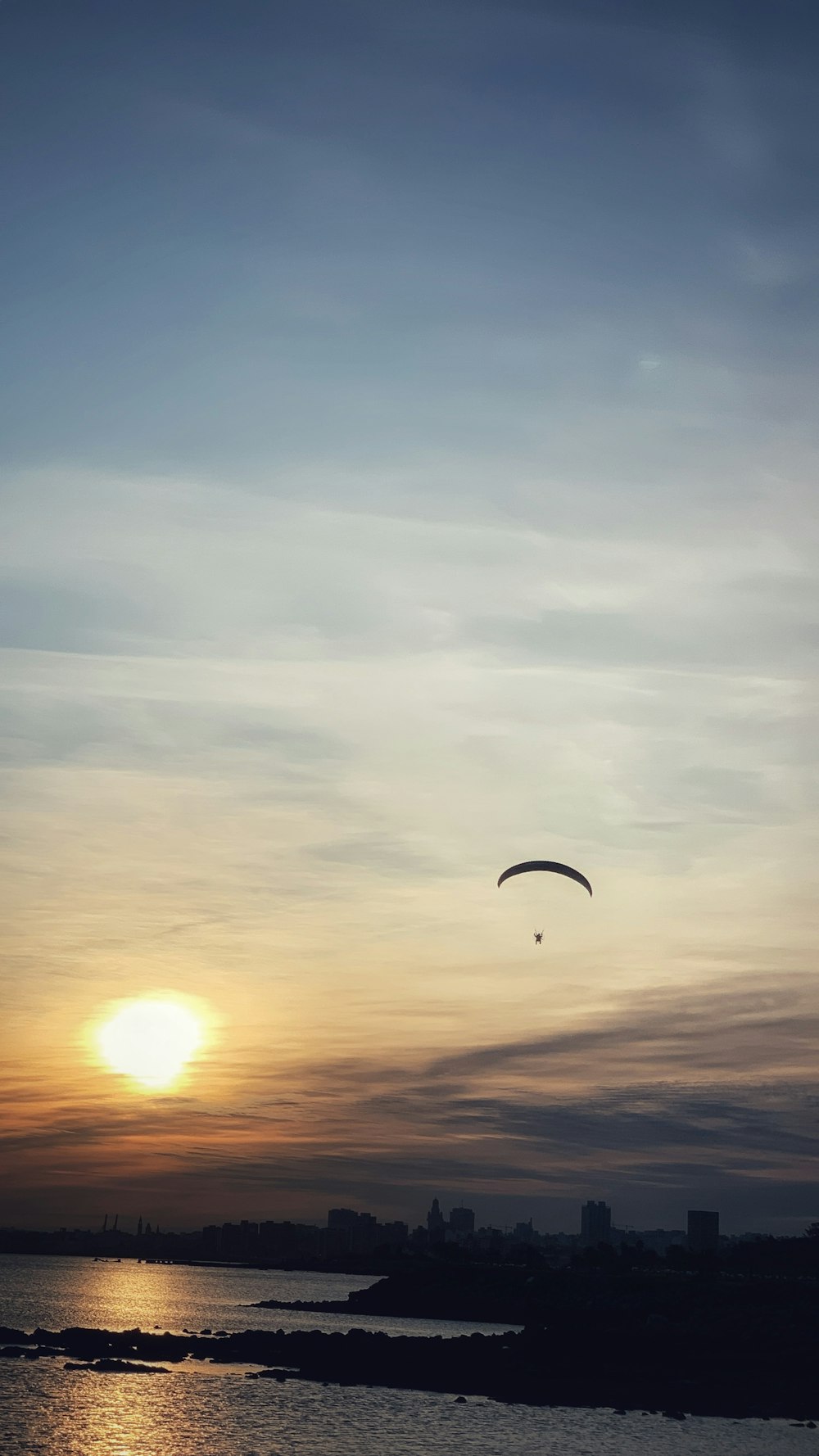 a person parasailing on the water