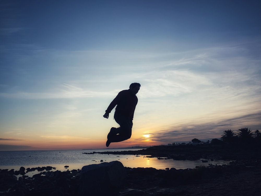 a man jumping on a surfboard