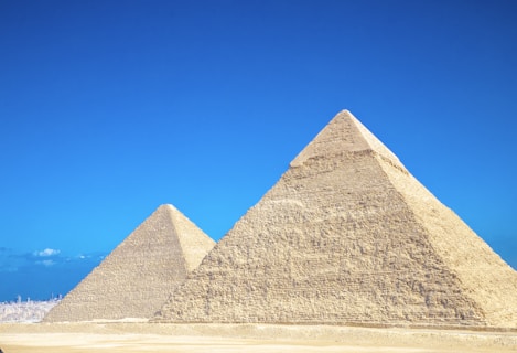 a group of pyramids in a desert