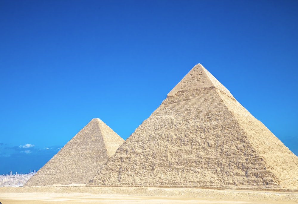 a group of pyramids in a desert