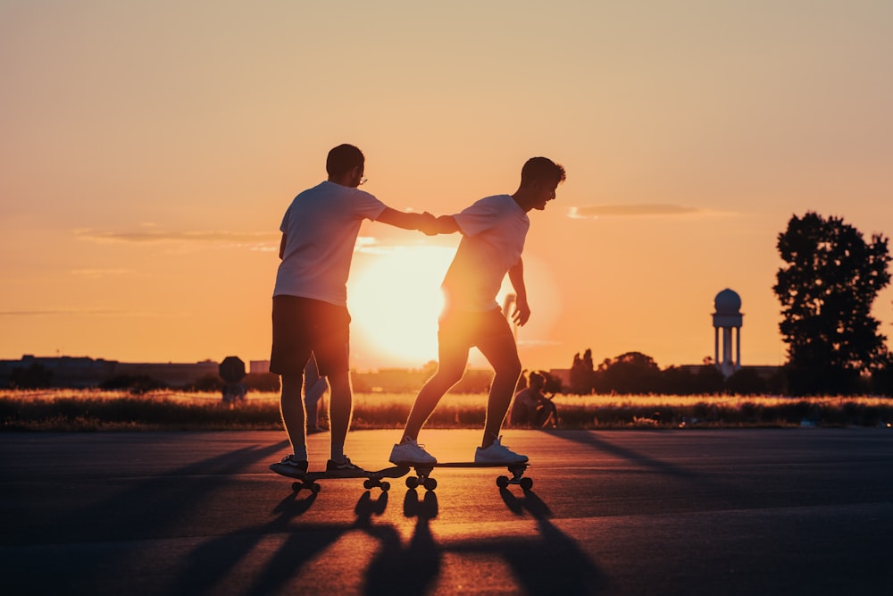 a couple of people skateboarding