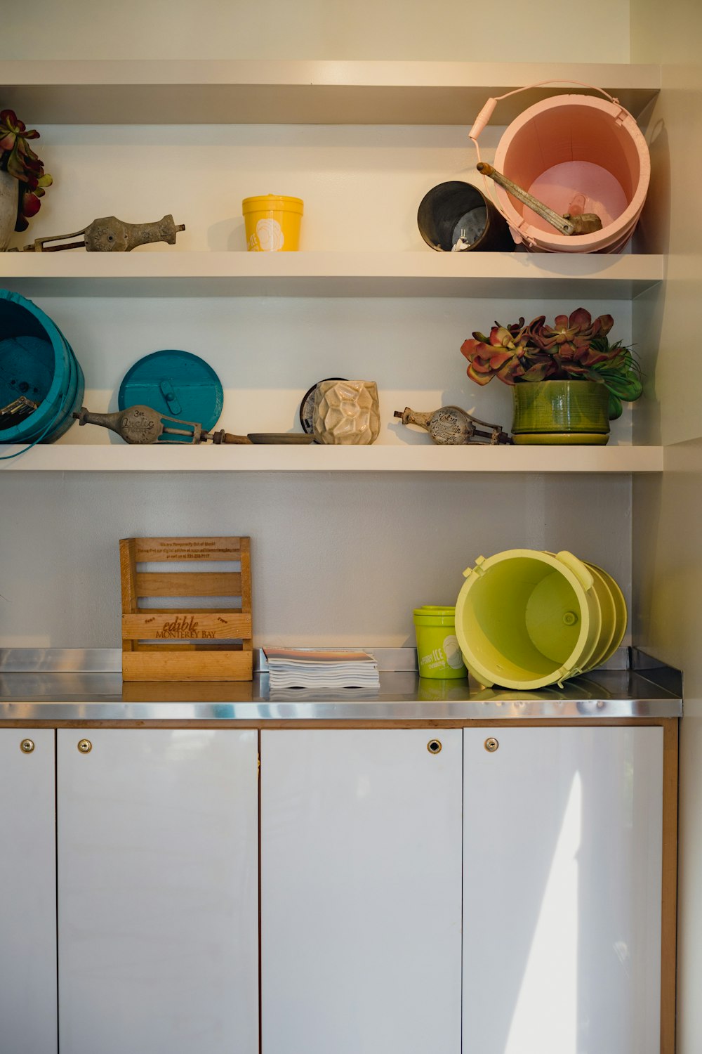 a kitchen with white cabinets and white cabinets