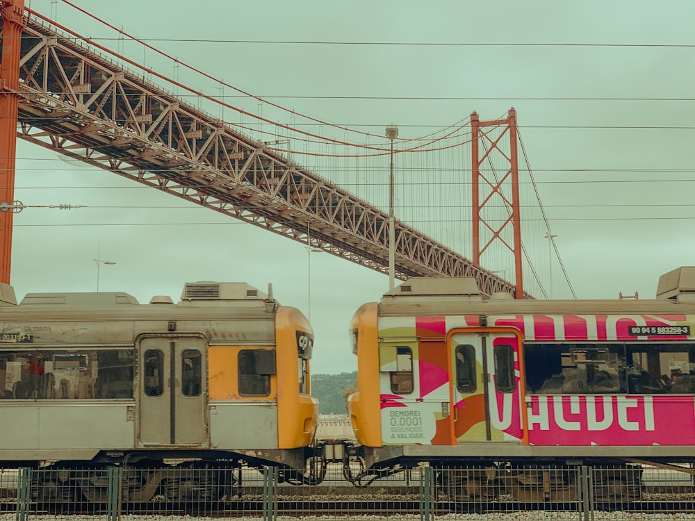 a couple of trains on a bridge
