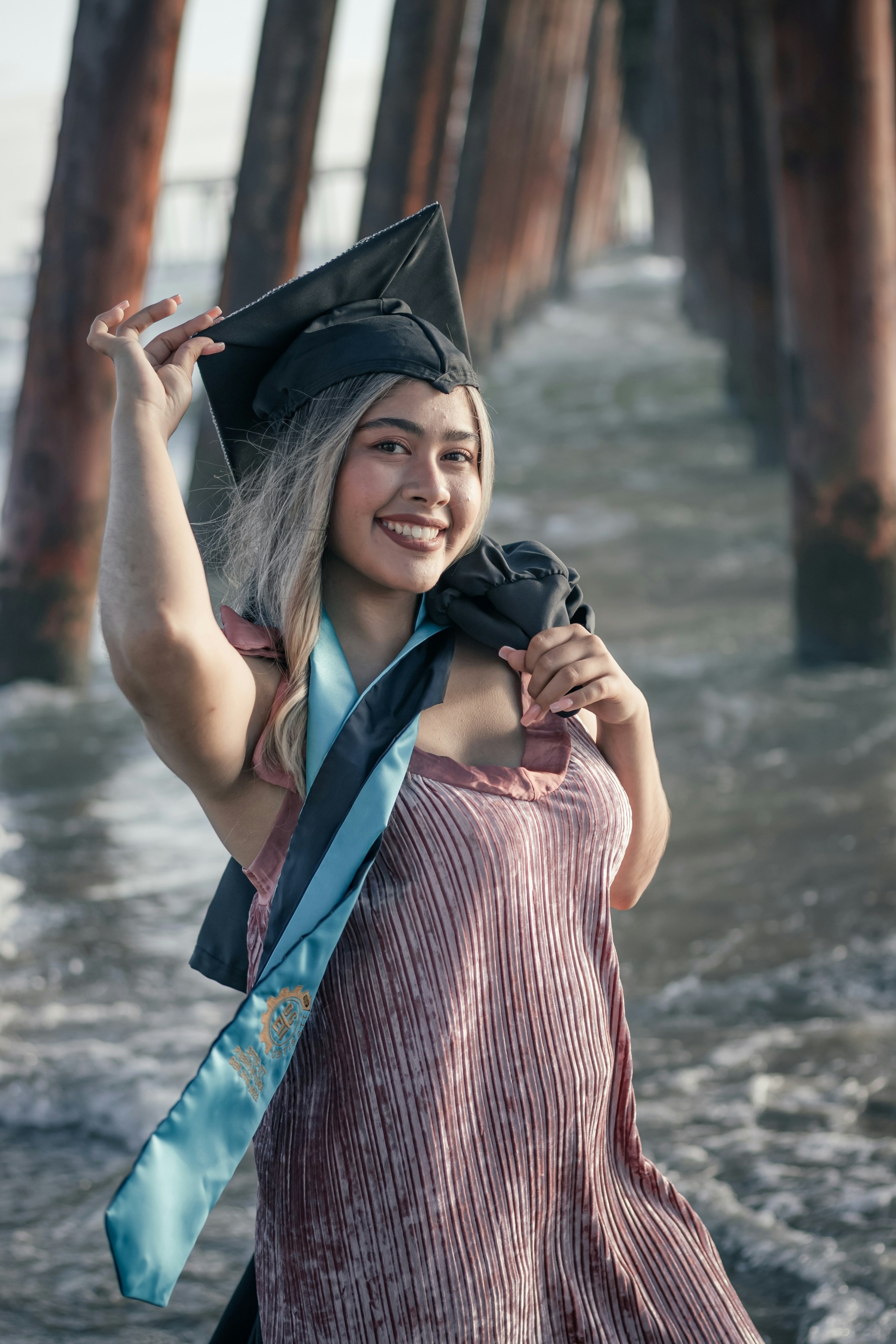 a person wearing a graduation cap and gown