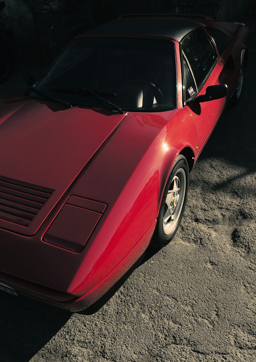 a red car parked on a road